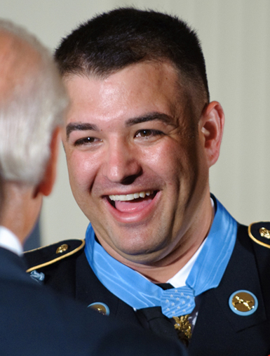 Friends of Army Sgt. 1st Class Leroy Arthur Petry inspect the Medal of  Honor he received at the White House.
