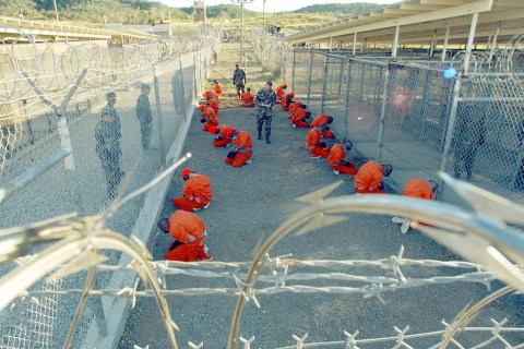 Taliban prisoners in orange jumpsuits si