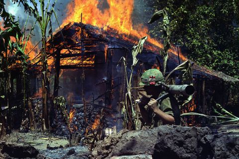 A Viet Cong base camp is torched
