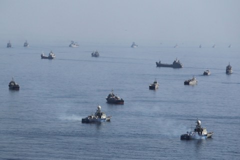 Iranian ships participate in a naval parade on the last day of the Velayat-90 war game on the Sea of Oman near the Strait of Hormuz