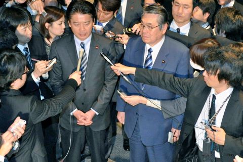 Japanese Foreign Minister Koichiro Gemba, center left, and Defense Minister Naoki Tanaka, right, announce plan to relocate Marines on Okinawa. It was roundly rejected. 