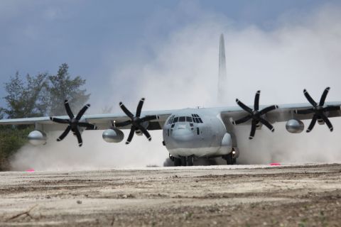 A Marine Corps C-130 touches down on Tinian Island’s North Field, Wednesday, May 30 – the first aircraft to land there since 1947. North Field was once the largest airfield in the Pacific and was the launching point for the atom bomb raids on Hiroshima and Nagasaki during World War II. Marine Aircraft Group-12 cleared and repaired runway Baker of jungle and undergrowth as part of a month-long expeditionary training exercise. The US and Japan are surveying sites on Tinian and elsewhere in the Northern Mariana chain for potential joint-training bases – part of the US “pivot” to the Asia-Pacific region.  USMC PHOTO