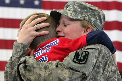 Spc. Teigh-jae Delancett, of Lafayette, Ga., embraces her 4-year-old son Trey, as members of the Georgia Army National Guard Dragon Masters arrive home from a year long duty in Iraq. 