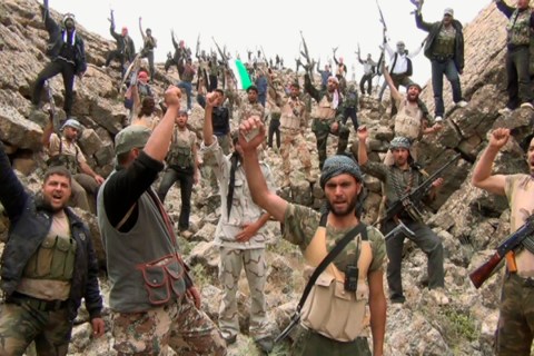 Free Syrian Army fighters shout "Allahu Akbar" near Deraa