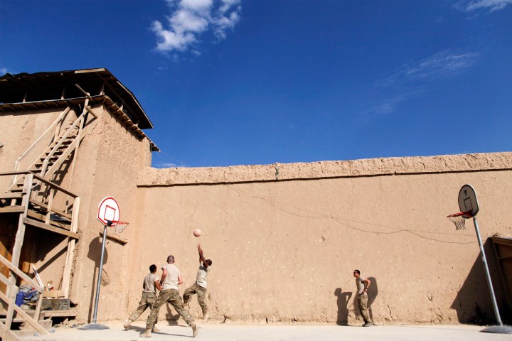 Paratroopers from the 3rd Battalion (Airborne), 509th Infantry of the 4th Brigade Combat Team, 25th Infantry Division play basketball inside a qalat compound at FOB Gardez in Afghanistan's Paktiya Province