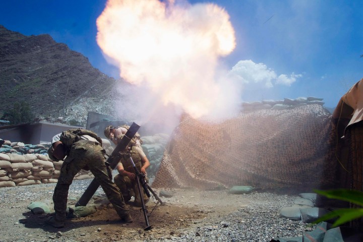U.S. Army soldiers fire 120mm mortar at insurgent positions 