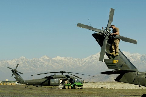 U.S. Army Soldier Works On MH-60 Blackhawk Helicopter