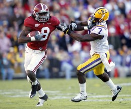 University of Alabama quarterback TC McCarney (8) runs for a first down past Louisiana State University cornerback Patrick Peterson (7)during their NCAA football game in Baton Rouge,