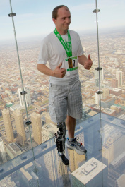 Vawter celebrates after climbing to the top of the 103-story Willis Tower using the world's first neural-controlled Bionic leg in Chicago