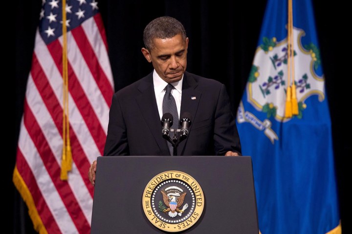 image: President Barack Obama pauses during a speech at an interfaith vigil at Newtown High School in Newtown, Conn., for the victims of the Sandy Hook Elementary School shooting on Dec. 16, 2012.