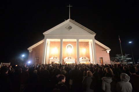 image: Mourners attend a vigil at St. Rose of Lima Roman Catholic Church in Newton, Conn., Dec. 14, 2012.