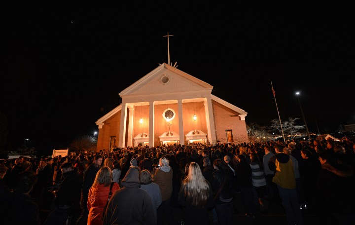 image: People gather for a prayer vigil at St. Rose Church following the shooting at Sandy Hook Elementary in Newtown, Conn., on Dec. 14, 2012.