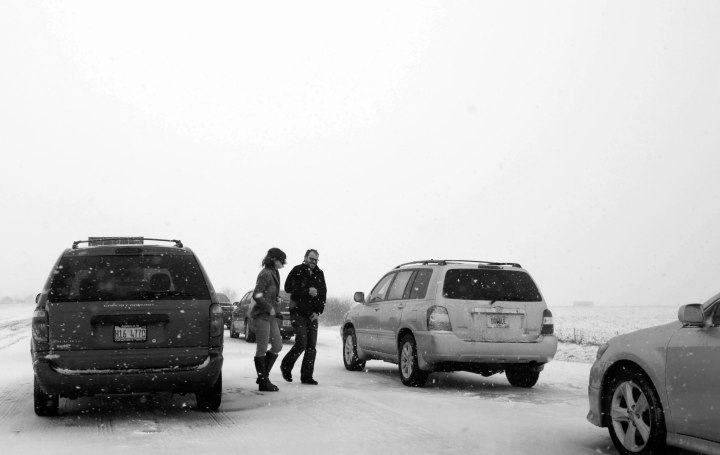 Image: Motorists exit their cars to walk around while stuck in traffic on Dec. 26, 2012 along I-65 South just north of Lafayette, Ind.