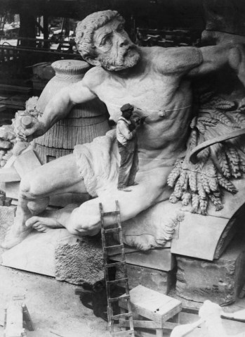 A worker carves a statue for display in Grand Central Station in New York City on July 1, 1918. 