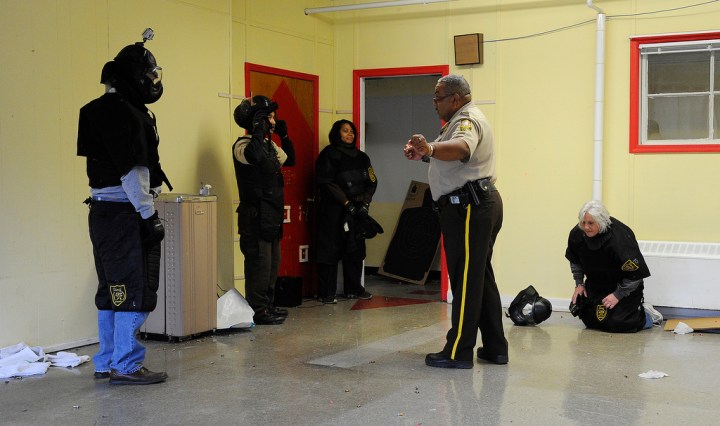 image: School administrators in Alabama's Jefferson County are debriefed by a law-enforcement official after participating in a school-shooting simulation in Birmingham on Jan. 2, 2013.