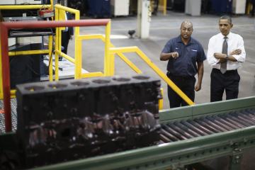U.S. President Obama is shown a truck engine block being manufactured as he tours Linamar Corporation in Arden, North Carolina