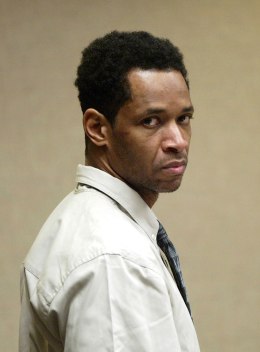 Sniper suspect John Allen Muhammad looks around the courtroom as his trial begins in Virginia Beach, Va., Oct. 14, 2003.
