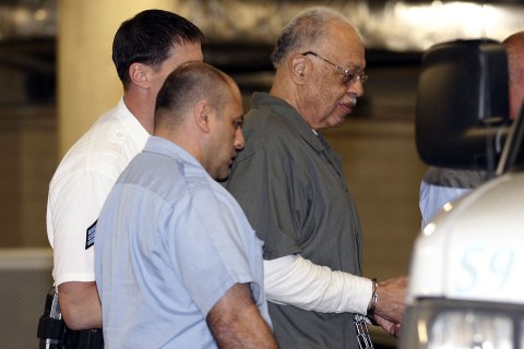 Dr. Kermit Gosnell, 72, right, gets escorted to a van leaving the Criminal Justice Center after getting convicted on three counts of first degree murder on Monday, May 13, 2013, in Philadelphia.