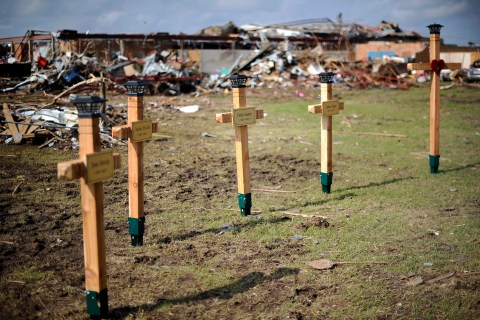 Crosses adorn a makeshift memorial on the grouds of the Plaza Towers elementary school in memory of the seven children who died during the devastating tornado, in Moore, Okla., May 25, 2013. 