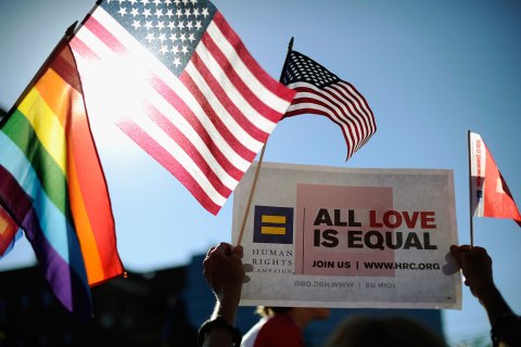 Same-sex marriage supporters celebrate the U.S. Supreme Court ruling during a community rally in West Hollywood, Calif., on June 26, 2013.