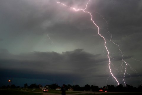 Cloud-to-ground lightning from a tornadic thunderstorm strikes in Cushing, Okla., on May 31, 2013.