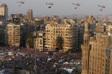 A view shows a fly-past over protesters against ousted Egyptian President Mursi in Tahrir Square in Cairo