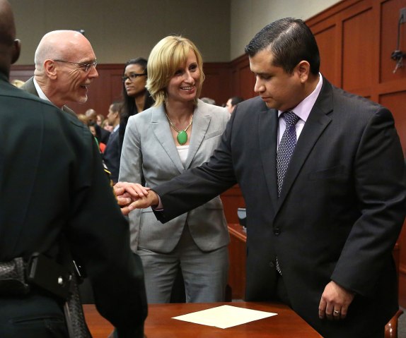 George Zimmerman is congratulated by his defense team after being found not guilty in the shooting death of Trayvon Martin at the Seminole County Criminal Justice Center in Sanford, Florida, July 13, 2013. 