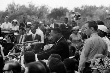 Martin Luther King Jr. begins his historic "I Have  a Dream" speech. Reading from his prepared texts.