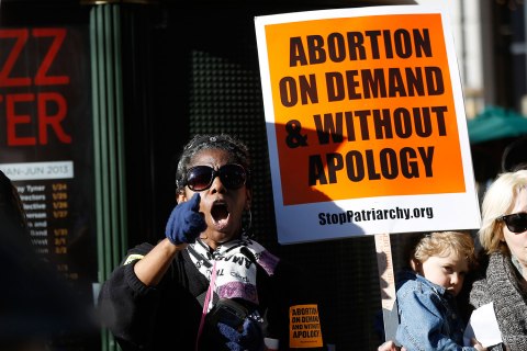 A pro-choice demonstrator holds a sign during a counter demonstration in San Francisco