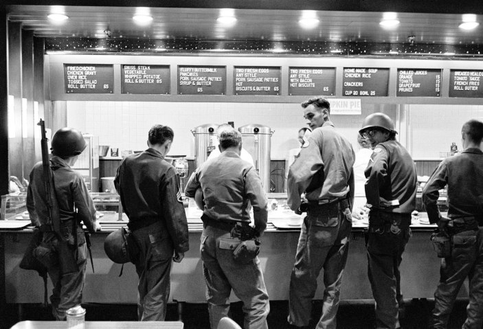 National guardsmen, brought in to maintain order in Birmingham, get their rations at local cafeteria in Birmingham, Ala., on Sept. 17, 1963. 