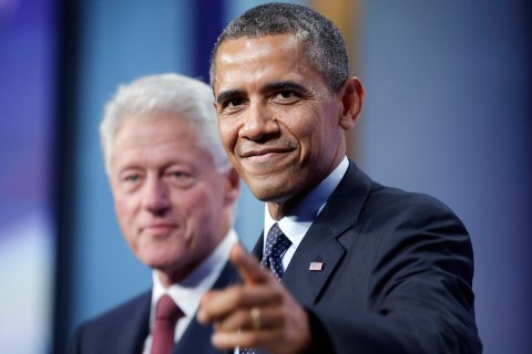 President Barack Obama, right, points to members of the audience after speaking at the Clinton Global Initiative with former President Bill Clinton, left, in New York, Tuesday, Sept. 24, 2013. 