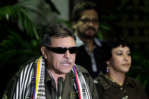 FARC negotiator Jesus Santrich speaks to the media before the start of talks in Havana