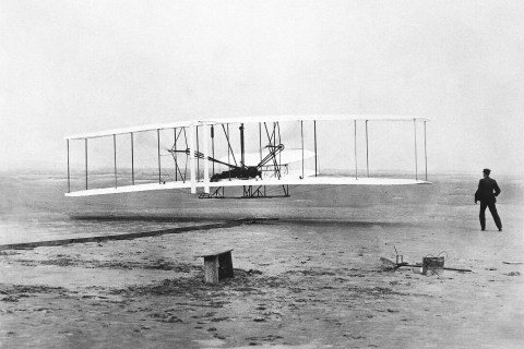 Orville Wright is at the controls of the "Wright Flyer" as his brother Wilbur Wright looks on during the plane's first flight at Kitty Hawk, N.C. Dec. 17, 1903.