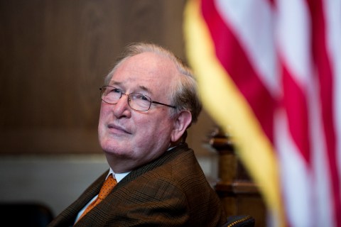 Sen. Jay Rockefeller listens during the news conference to call, Dec. 11, 2012.