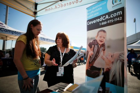 People at event to inform people about the Affordable Care Act and donate turkeys to 5,000 needy families, in Los Angeles