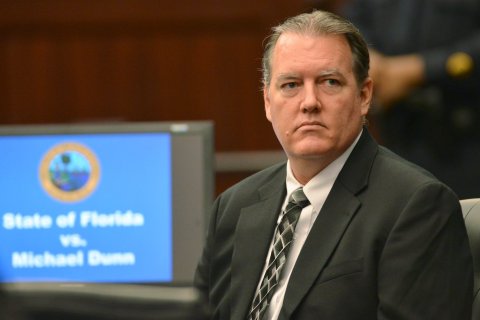 Defendant Michael Dunn looks back at his family on day two of his first-degree murder trial in Jacksonville, Fla. , on Feb. 7, 2014.